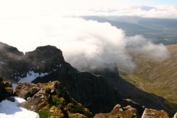 Thick cloud sweeps over the mountainside