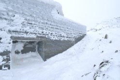 Snow on summit buildings