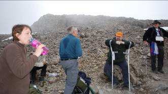 Almost to the top of the zigzags, the team take a breather